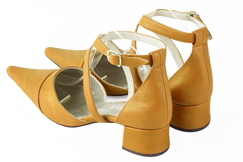 Mustard yellow women's open side shoes, with crossed straps. Pointed toe. Low flare heels. Rear view - Florence KOOIJMAN